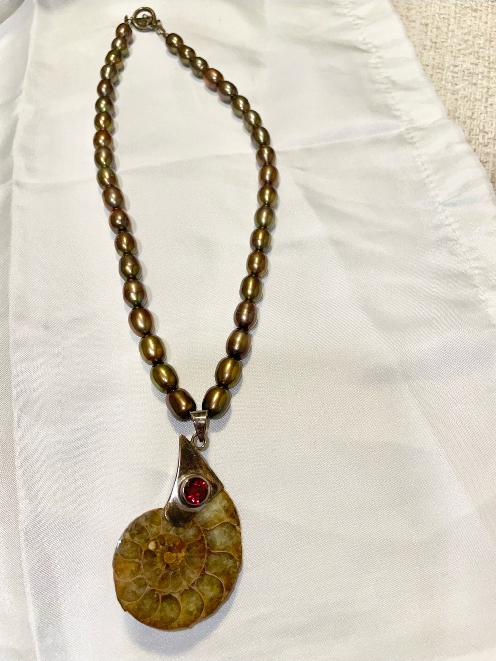 Vintage-Inspired Brown Pearl Necklace with Ammonite Pendant and Red Stone Accent